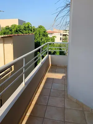 a balcony with a railing on a building at Platanias Memories Studio 5 in Plataniás