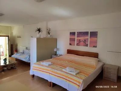 a bedroom with a large bed in a room at Lovely small apartment in Chania Town