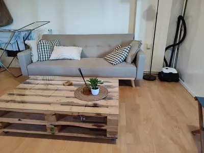 a living room with a couch and a coffee table at Lovely small apartment in Chania Town