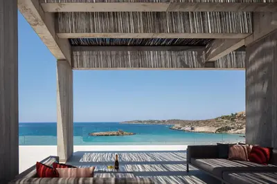 a living room with a view of the ocean at Beach Rock in Chania Town