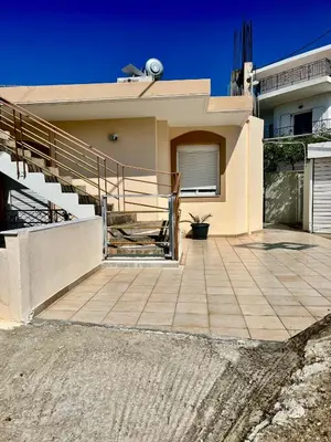 a house with a staircase and a patio at Dream Apartments 3 in Palaiochóra