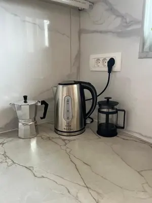 a coffee maker and a blender on a counter at Dream Apartments 3 in Palaiochóra