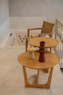 a table and chairs and a tub in a room at Hestia Boutique Rooms in Agia Marina Nea Kydonias