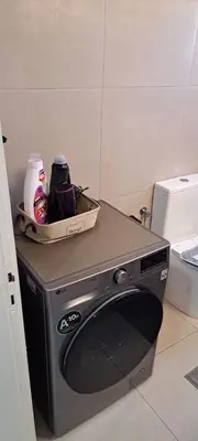 a washing machine with a box on top of it at Gio's Central Cosy Apartment with private balcony in Chania Town