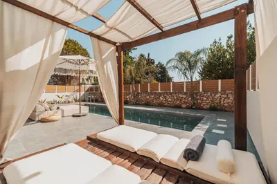 a view of the pool from the patio of a house at Nos Aqua Villas Chania in Pazinos