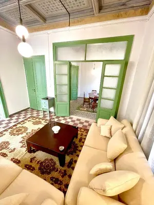 a living room with a couch and a table at La Sistina in Chania Town