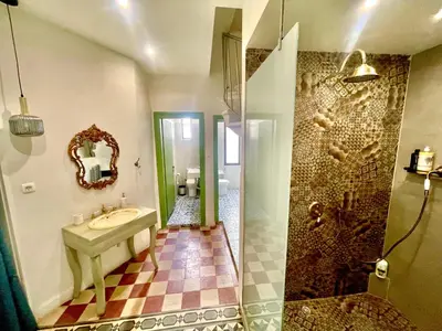 a bathroom with a sink and a shower at La Sistina in Chania Town