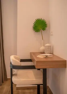 a table with a potted plant on top of it at Kiwi Boutique Studios in Kissamos
