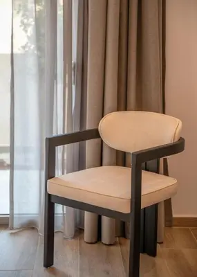 a table and a chair in front of a window at Kiwi Boutique Studios in Kissamos