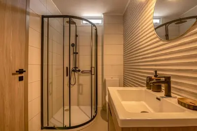 a bathroom with a sink and a shower at Vissalo Studios in Kissamos