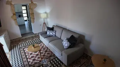 a living room with a couch and a table at Stefanie's House in Chania Town