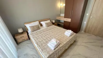 a bedroom with a bed with two towels on it at Fiorella Sea View Pool Villa in Kalyves, Chania area, Crete in Kalyves