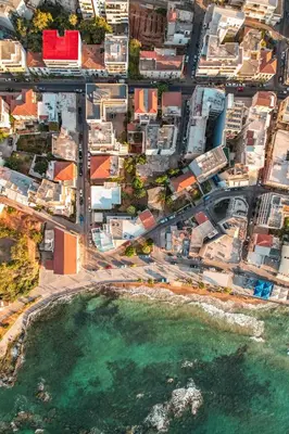 an aerial view of a city with a body of water at All Seasons Luxury Apartment in Chania Town
