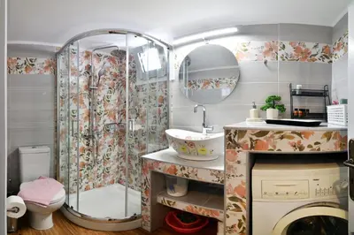 a bathroom with a shower and a sink and a toilet at Favola Golden Beach Villa in Daratso
