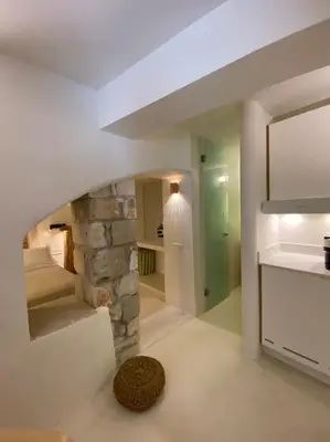 a kitchen with a stone fireplace in a room at Teviot, 