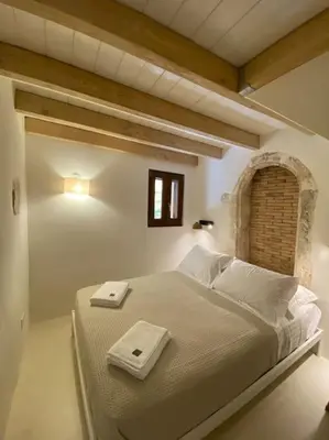 a bedroom with a large bed with two plates on it at Teviot, 