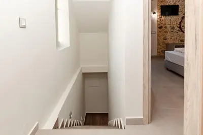 a room with a staircase leading to a bedroom at Villa Elpida in Myloniana in Milonianá