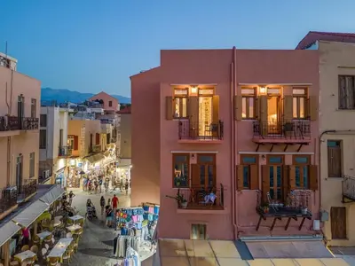 a view of a street in a city with people walking at Leo Apartment 2 bdr apt overlooking the harbor in Chania Town