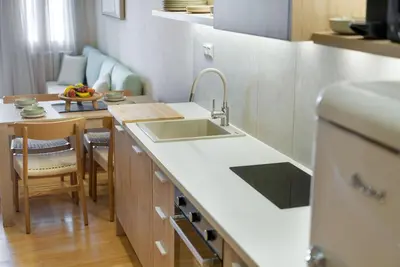 a kitchen with a sink and a counter top at Leo Apartment 2 bdr apt overlooking the harbor in Chania Town