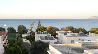 a view of the ocean from a building at Villa Cicada Chania, steps from the beach, Car included in Agia Marina Nea Kydonias