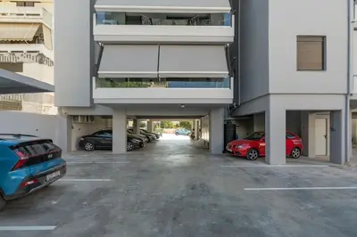 a parking lot with cars parked in a building at Comfy Apt terrace and parking 800m to old town and beach in Chania Town