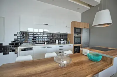 a kitchen with a table with a glass bowl on it at Villa Sapphire by PosarelliVillas in Almirida