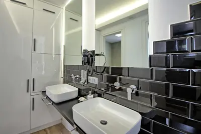 a bathroom with a sink and a mirror at Villa Sapphire by PosarelliVillas in Almirida