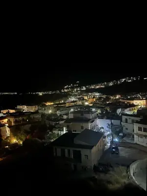 a view of a city at night with lights at Κρητικό Σπίτι Στον Παράδεισο in Palaiochóra