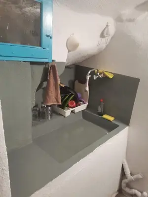 a kitchen sink with a blue cabinet above it at Κρητικό Σπίτι Στον Παράδεισο in Palaiochóra