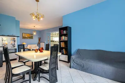 a living room with a table and chairs and a bed at Large Cozy House near the sea - Kolimvari Village - 6 Pax in Kolymvari