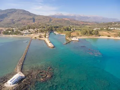 an aerial view of a beach with a boat in the water at Villa Olivia with Pool Vrises Crete in Alikampos