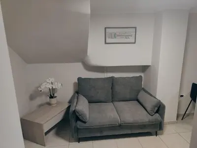 a living room with a couch and a table at Foumidon Apartments, Chania in Chania Town