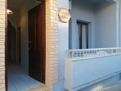 a door to a house with a welcome sign on it at Ελευθέριος, rooms 1 in Chania Town