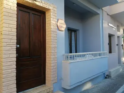 a wooden door on the side of a building at Ελευθέριος rooms 2 in Chania Town