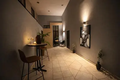 a hallway with a table and chairs in a building at Endless blue suites 4 in Chania Town