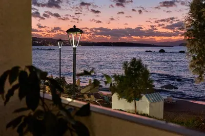 a view of a body of water with a street light at Callista Seafront Studio in Chania Town