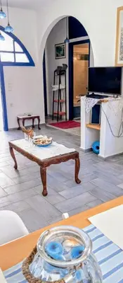 a living room with a coffee table in a room at Erofili Apartment in Kalyves