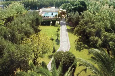 an aerial view of a garden with trees and a house at Proimos Apartments in Gerani Chanion