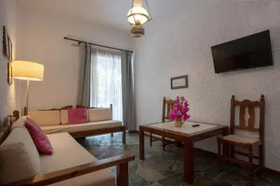 a living room with a couch and a table at Hotel Agapi Apartments in Plataniás