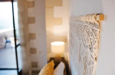 a couch in a living room with a lamp at Villa Elia Provarma - Your villa in Chania Town