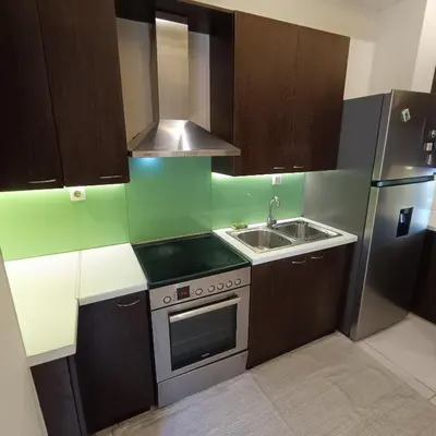 a small kitchen with a sink and a refrigerator at Drosoula house in Chania Town