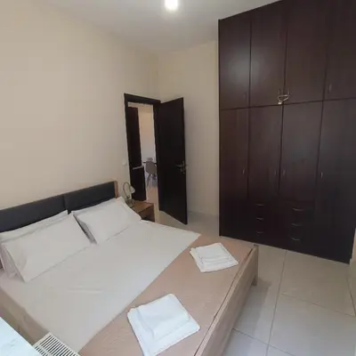 a bedroom with a large bed with two towels on it at Drosoula house in Chania Town