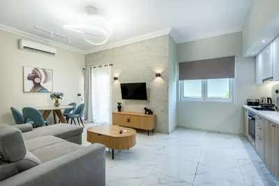 a living room with a couch and a table at Hypnos Luxury Lodgings in Chania Town