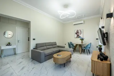 a living room with a couch and a table at Hypnos Luxury Lodgings in Chania Town