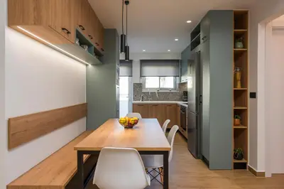 a kitchen and dining room with a wooden table and chairs at Be Crete - White Pearl in Chania Town