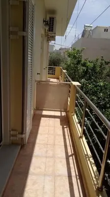 a balcony of a building with a walkway at QUIET NEW Apartment-5' to the beach, 15' to center in Chania Town