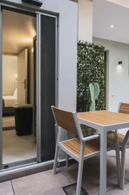 a dining room with a table and chairs at Peris 4 with Yard steps to Old Town - AC, Wifi in Chania Town