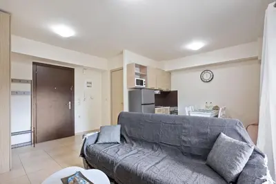 a living room with a couch and a kitchen at Dimi's Studio Center in Chania in Chania Town