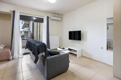 a living room with a couch and a tv at Dimi's Studio Center in Chania in Chania Town