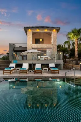 a house with a swimming pool in front of a house at Villa Shell in Tersanas